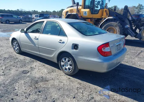 2002 Toyota Camry Le z USA, uszkodzony, nr VIN 4T1BE32KX2U117098